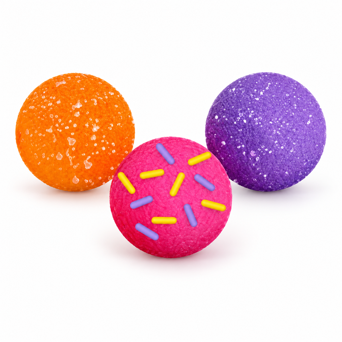 NeeDoh Dohnut Holes in orange, pink with sprinkles, and purple with a sugary texture