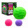 Super NeeDoh Fuzz Ball in green next to its box, with pink and purple fuzz balls