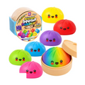 Mystery Squishy Dumpling Rainbow Edition box with colorful dumplings and a rainbow dumpling in its steamer