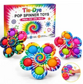 Three tie-dye pop spinners with the box