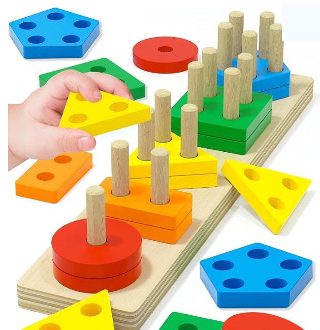 Colorful wooden shapes stacked on the pegs of a wooden board